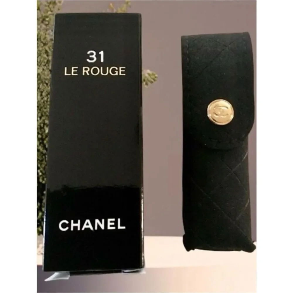 Chanel 31 Le Rouge lipstick case, a black quilted velvet pouch.